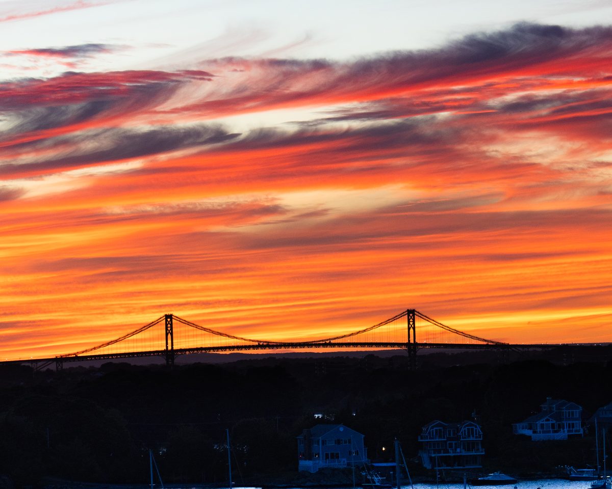 Mount Hope Bridge against a burning sky